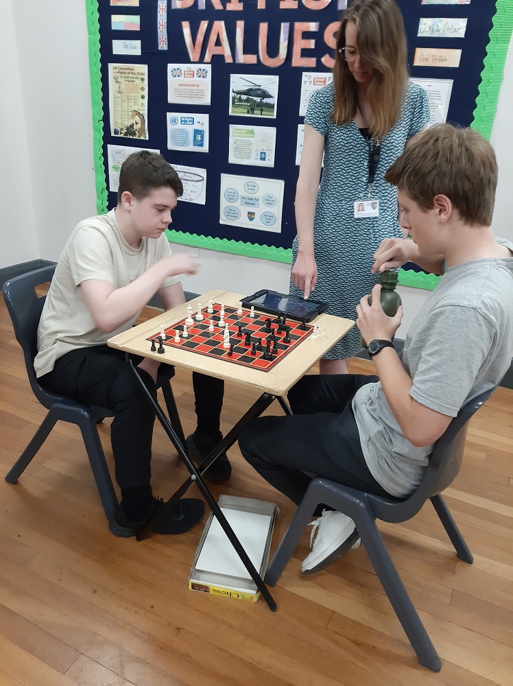 Two pupils playing chess
