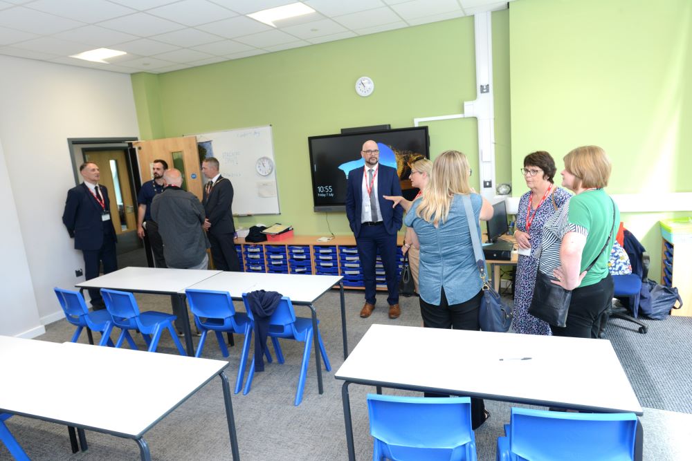 Dignitories view a new classroom