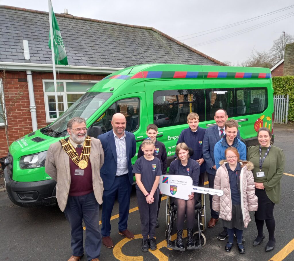 The Mayor of Grantham, Martyn Dobson (CEO of Lincolnshire Cricket Club), and pupils with the new minibus