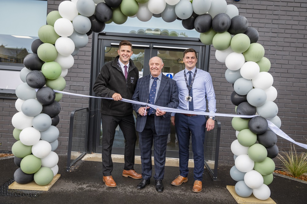 Headteacher and Tim Reddish CBE cut the ribbon