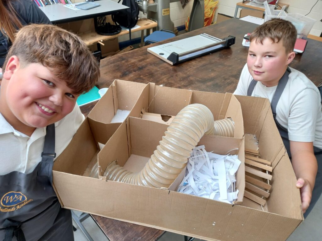 pupils show off their finished creations